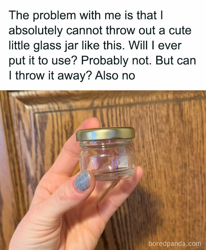 Hand holding a small glass jar, reflecting a funny meme about difficulty in throwing away useful items.