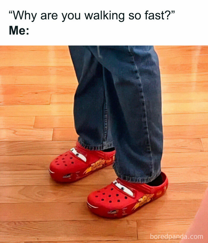 Person wearing red cartoon-themed Crocs, illustrating a funny meme.