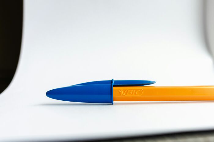 Durable Bic pen with blue cap on white background, designed for longevity.