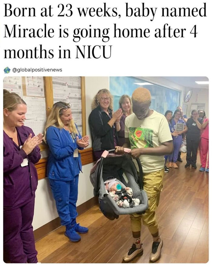 Man carrying baby in NICU, surrounded by clapping staff, showcases faith in humanity restored.