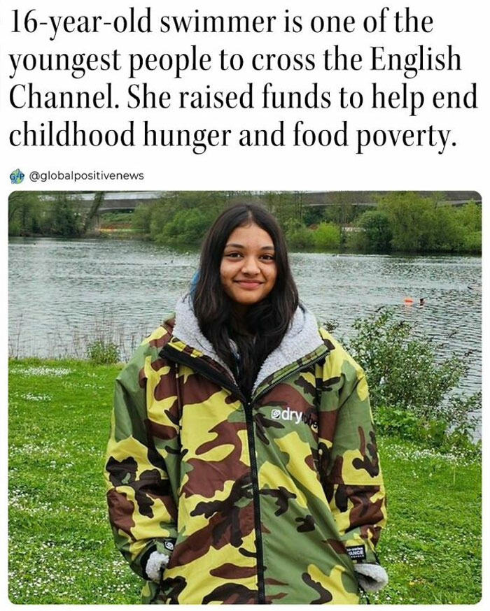Teen swimmer by a river, wearing a camo jacket, promotes positive news by fundraising for childhood hunger and food poverty.