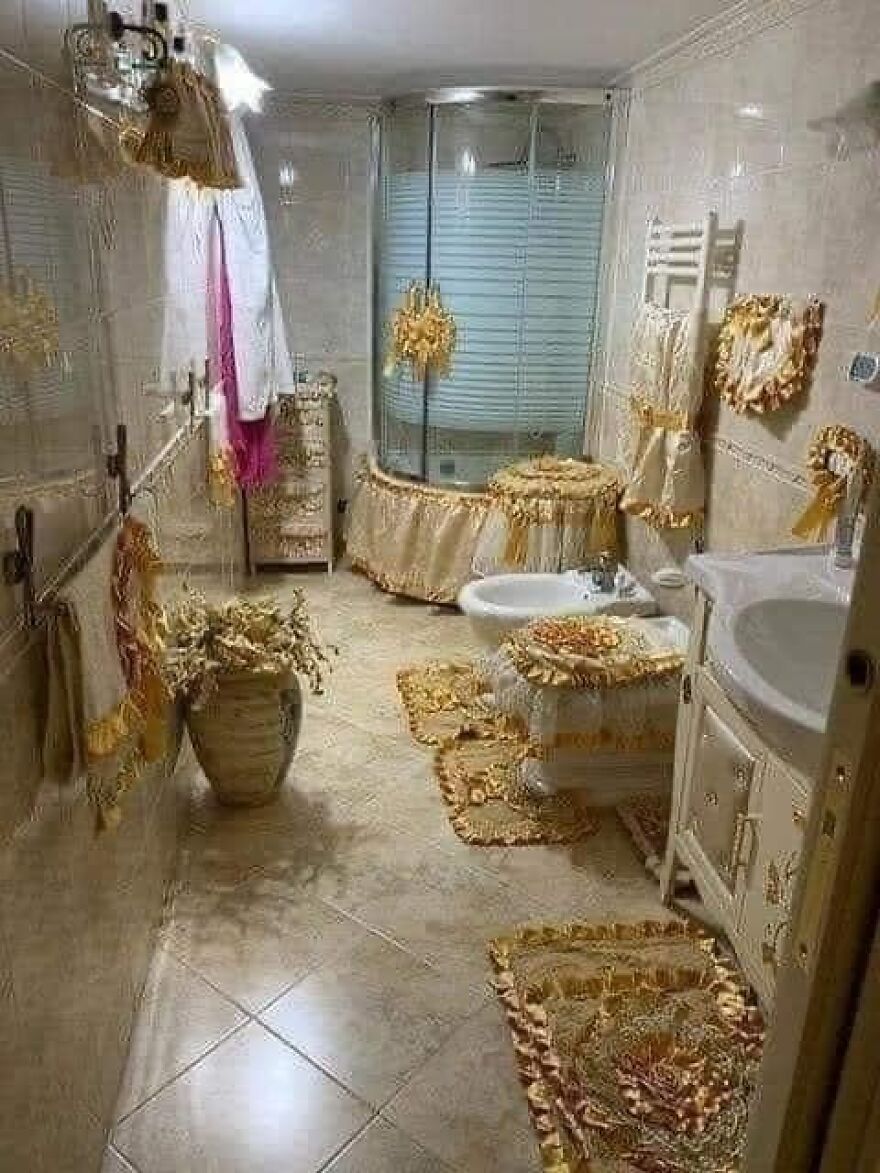 Bathroom with excessive fabric decorations, embodying architecture shaming trends in design.