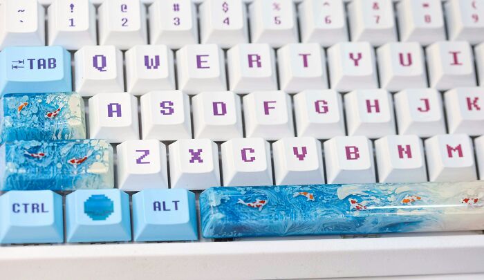 Unique keyboard with custom ocean-themed keycaps, including colorful fish, enhancing gift ideas for hard-to-shop-for people.