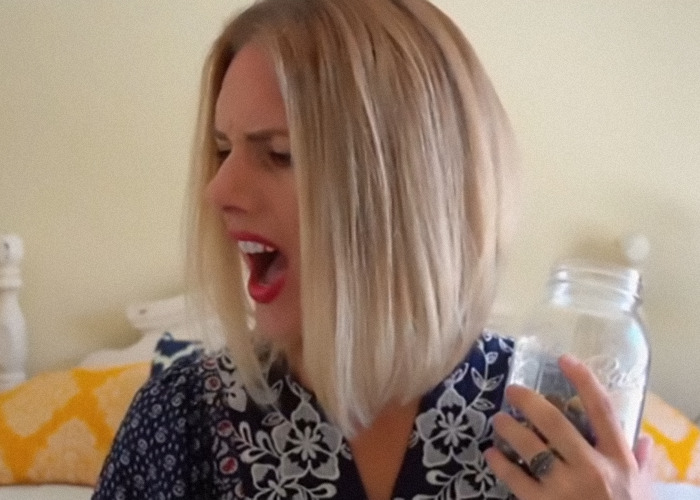 Ruby Franke with an angry expression holding a jar. Ruby Franke with an angry expression holding a jar.