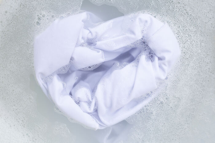 A white shirt in soapy water, representing bizarre cleanliness secrets.