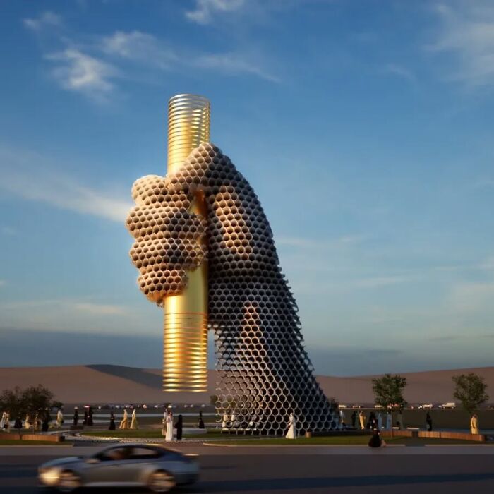 Metal pipe sculpture of a giant hand holding a cylinder, created by Yi Chul Hee, set against a blue sky.