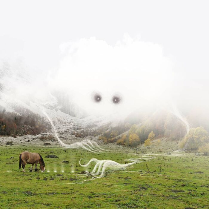 Horse grazing in a green field with ethereal cloud entity, part of Vorja Sánchez's "Interventions" series.