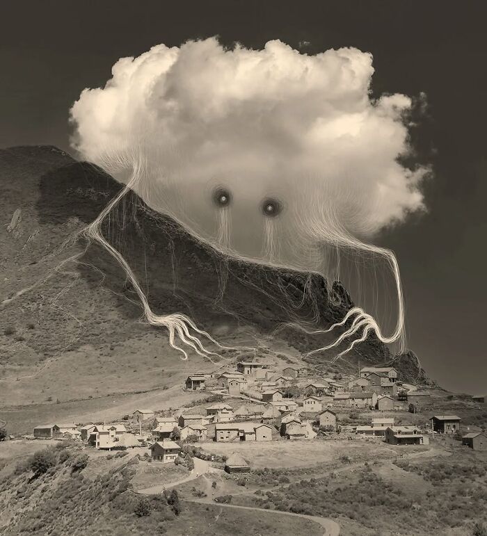 Surreal artwork by Vorja Sánchez featuring a cloud-like creature above a village, titled "Interventions."
