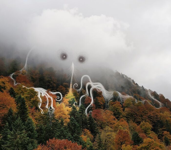 Mysterious cloud formation by Vorja Sánchez resembling an octopus over an autumn forest, showing artistic interventions.
