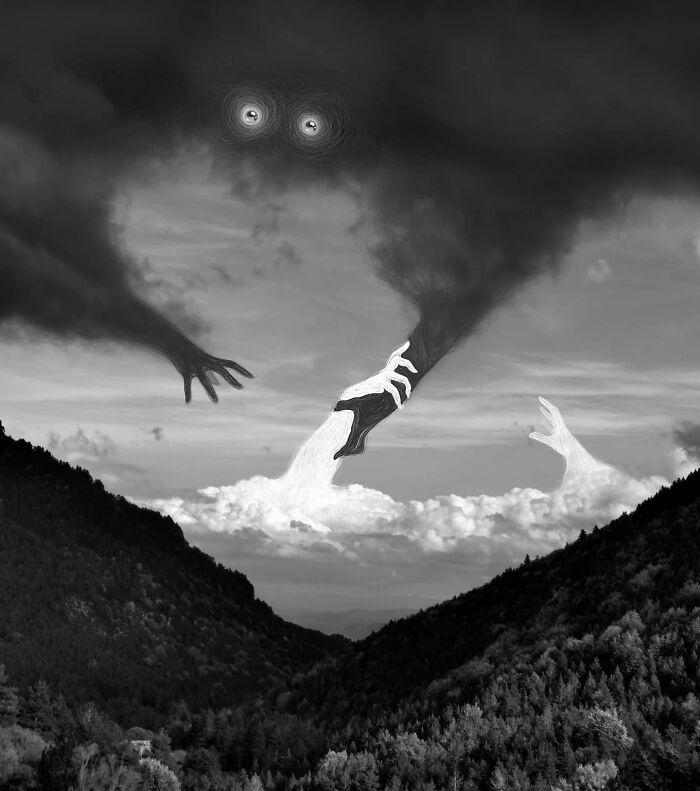 Abstract art by Vorja Sánchez showing surreal hands and eyes in a dark cloudy sky over mountains.