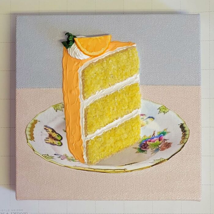 Hyper-realistic embroidered dessert resembling a lemon cake slice on a decorative plate.