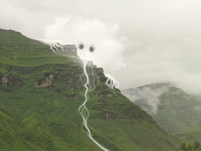Artistic intervention by Vorja Sánchez depicting a mountain with a whimsical cloud creature above it.