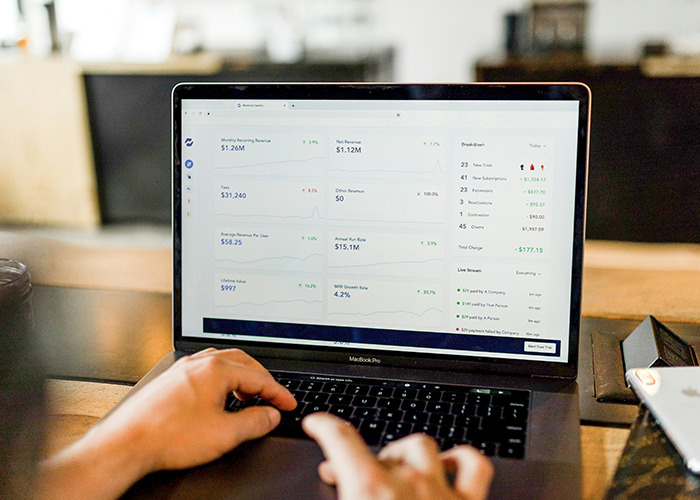 Person using a laptop displaying digital analytics, showcasing life skills in data management.