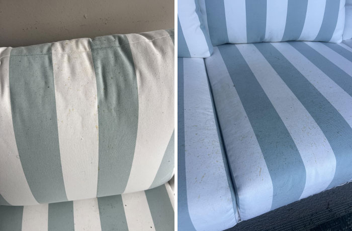 Close-up of striped cushions showing stains, possibly from terrible neighbors, highlighting cleanliness issues.