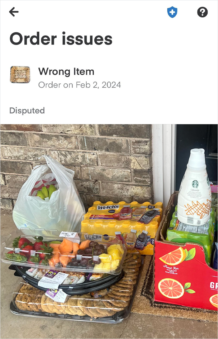Instacart shopper delivery issue with assorted grocery items, including fruit and juice, marked as wrong item.