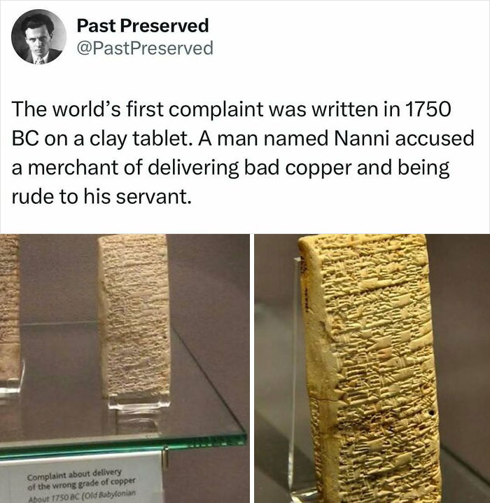 Ancient clay tablet, world's first complaint from 1750 BC, displayed in a glass case.
