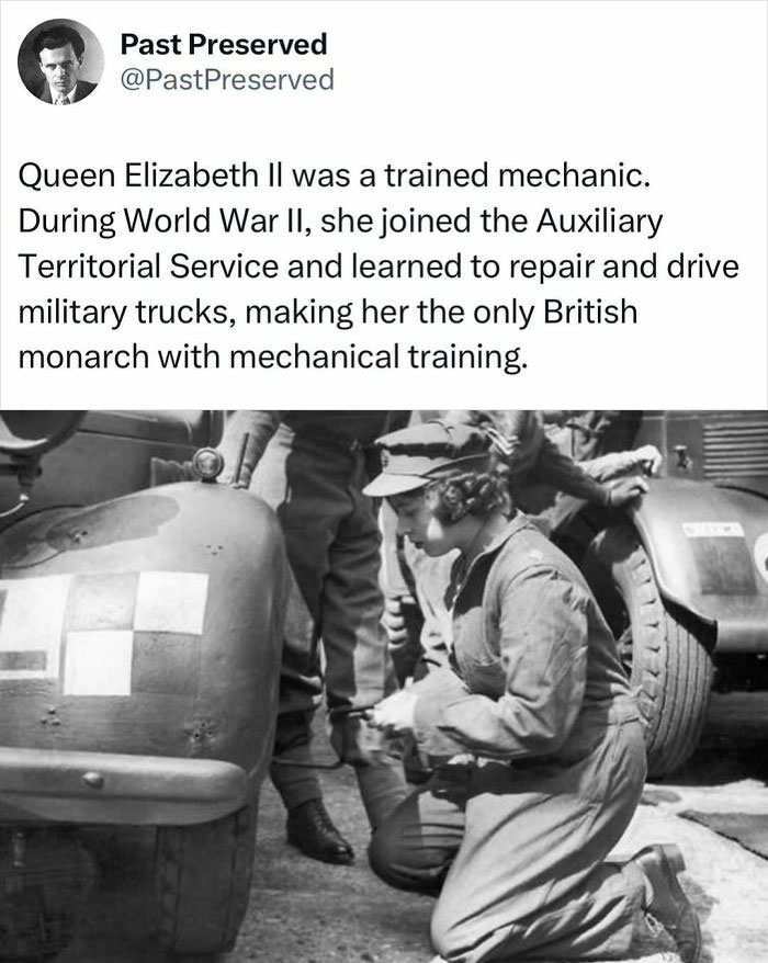 A woman in military uniform kneels beside a vehicle, demonstrating historical mechanics training.
