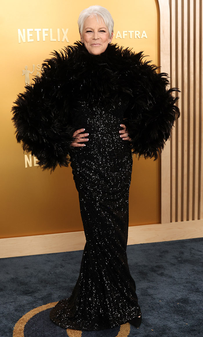 Jamie Lee Curtis in a black feathered gown on the SAG Awards red carpet, noted for one of the worst looks.