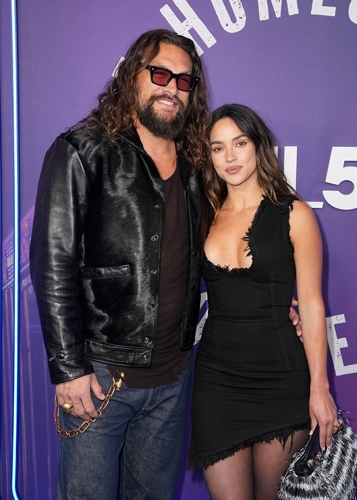 Jason Momoa on the red carpet with new girlfriend, wearing stylish outfits and posing together.