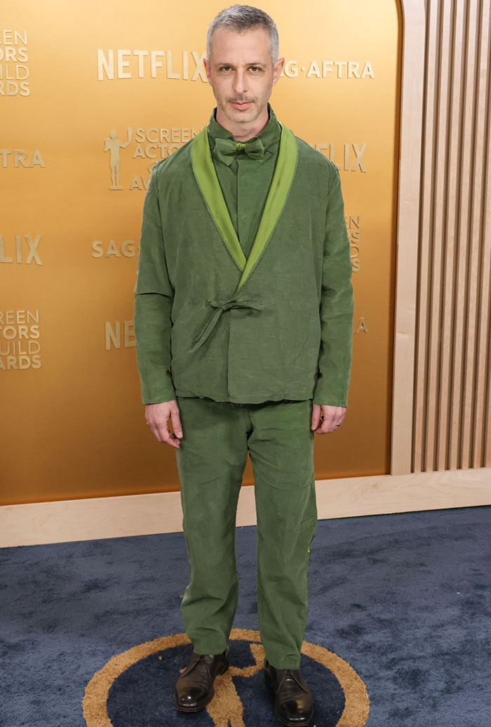 Jeremy Strong in green suit at SAG Awards red carpet, representing worst looks theme.