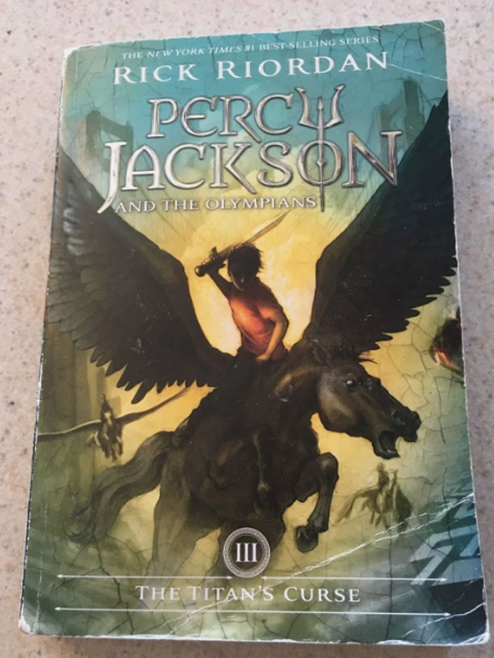 Cover of "Percy Jackson III: The Titan's Curse" with a winged horse and rider, illustrating a book quote.