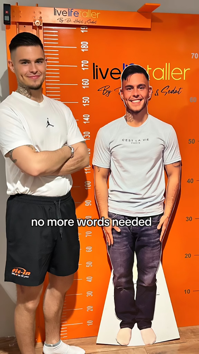 Leon Otremba standing beside life-size cutout of himself next to a height chart. Leon Otremba standing beside life-size cutout of himself next to a height chart.
