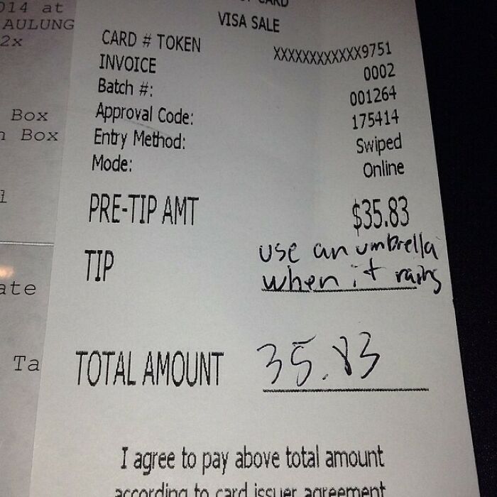 Receipt showing a humorous server tip: "Use an umbrella when it rains."