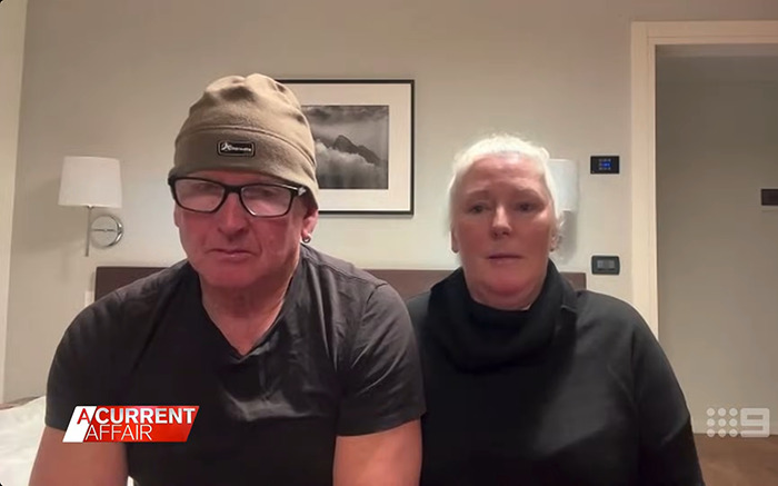 Couple discussing their traumatic experience on a flight, sitting in a room. Couple discussing their traumatic experience on a flight, sitting in a room.