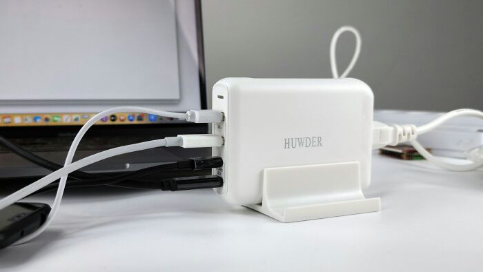 Portable multi-port charger on a desk, an essential for easier and more peaceful traveling.