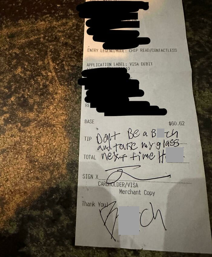 Receipt with handwritten note expressing frustration, related to server tips.