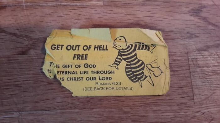 A worn "Get Out of Hell Free" card, carried for sentimental reasons despite its uselessness.