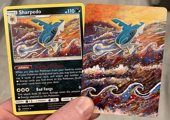 Person holding two Sharpedo cards, illustrating sentimental items despite being useless.