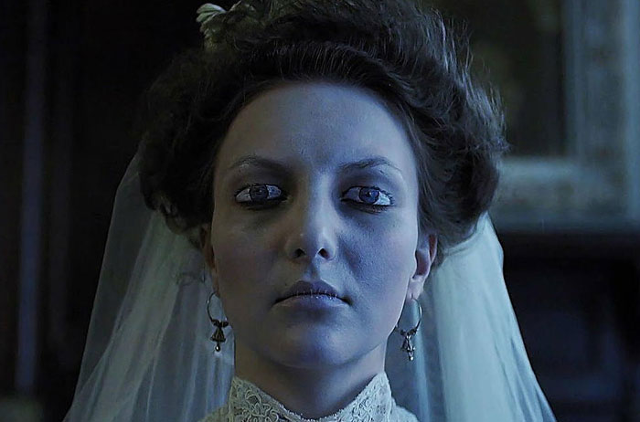 Mysterious character from "The Bride!" in a wedding dress, showcasing a scene from anticipated movies of 2025.