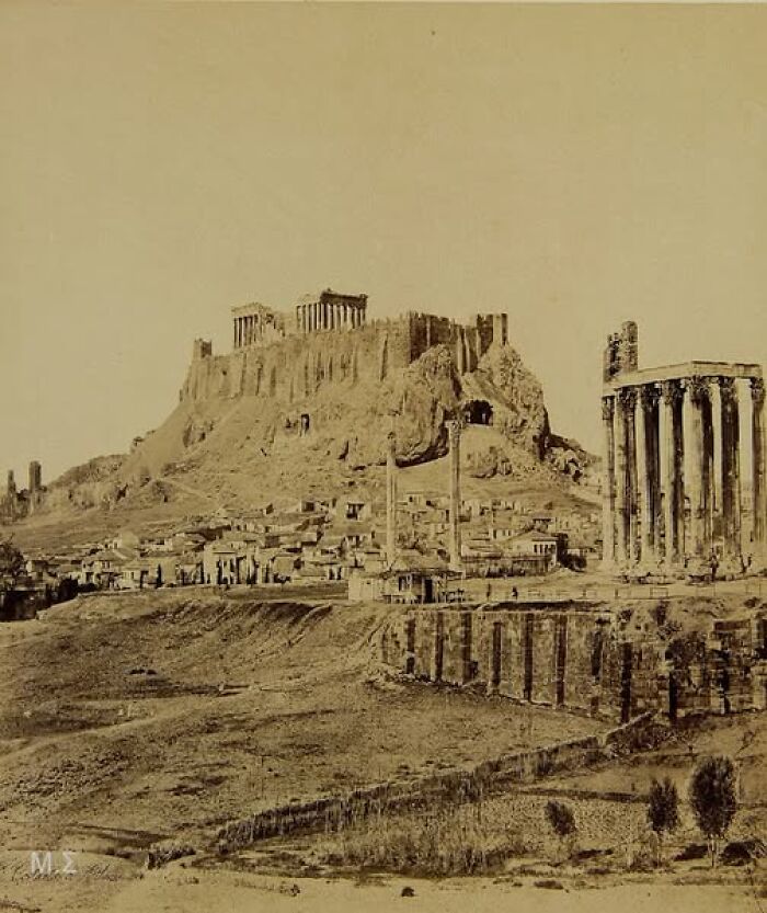 Ancient ruins with historic architecture, highlighting the resonance of photos from over a hundred years ago.