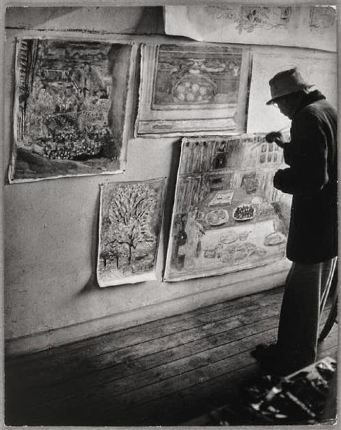 A person in vintage attire analyzing historical paintings, evoking themes that resonate today.