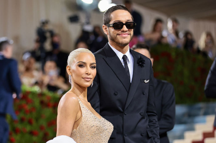 Did Pete Davidson and Kim Kardashian posing elegantly at a formal event, sparking interest in their love story.