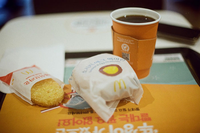 Fast food meal with coffee on a tray, possibly connected to petty grudges theme.
