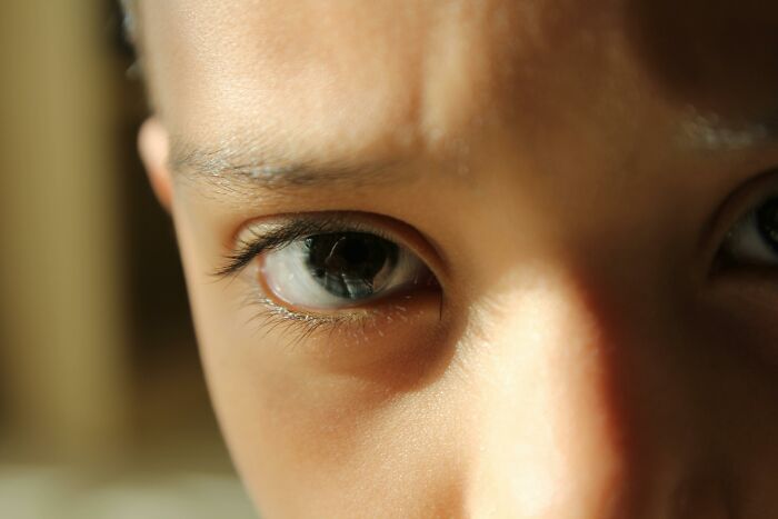 Close-up of a person's eyes, hinting at deeply weird personal flags or traits.