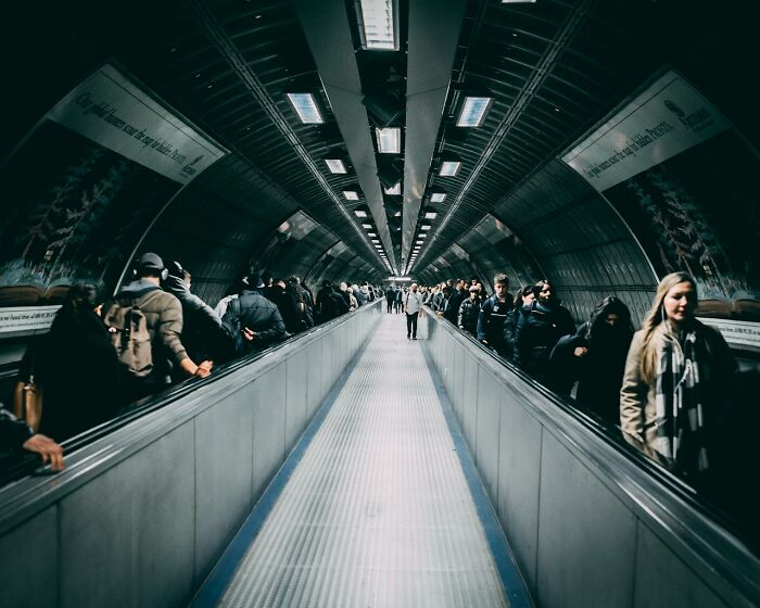 Underground walkway filled with people, illustrating culture shocks experienced in a bustling city environment.