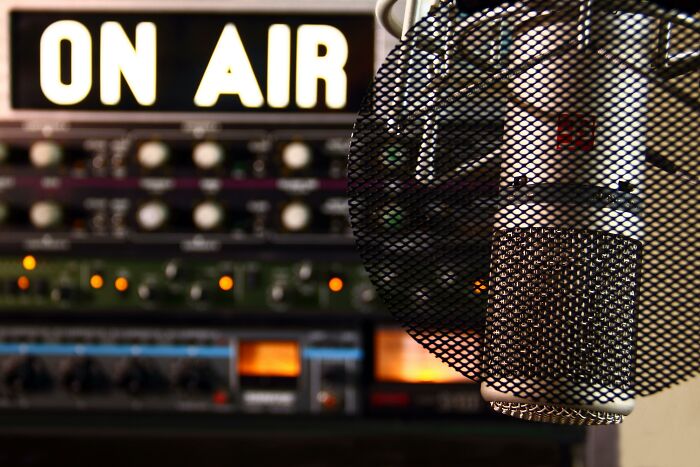 Radio microphone and "On Air" sign, symbolizing pop culture moments.