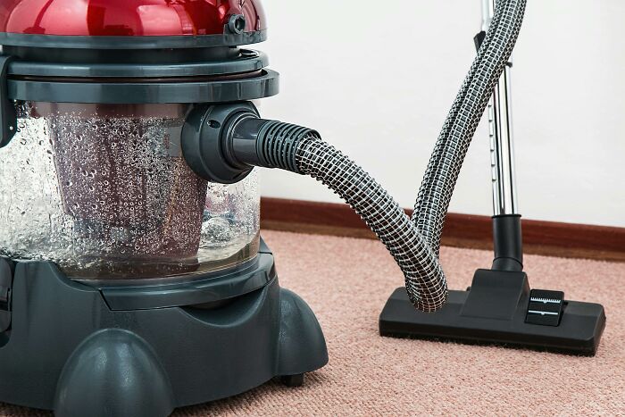 A retro vacuum cleaner on carpet illustrates future predictions that aged bad.