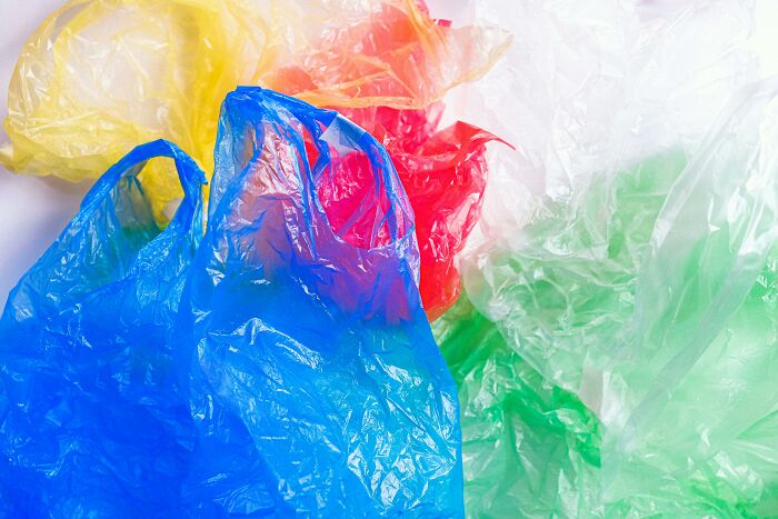 Colorful plastic bags scattered, representing essentials for easier and more peaceful traveling.