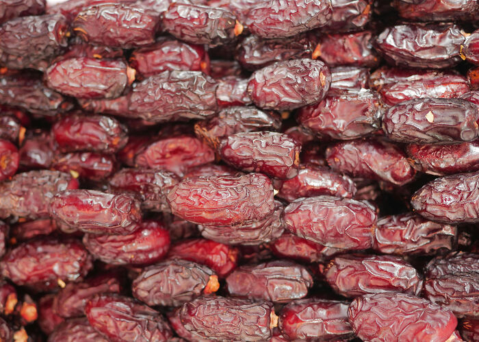 Close-up of ripe dates, showcasing their rich texture, a must-have in the ultimate fruit guide for health-boosting benefits.