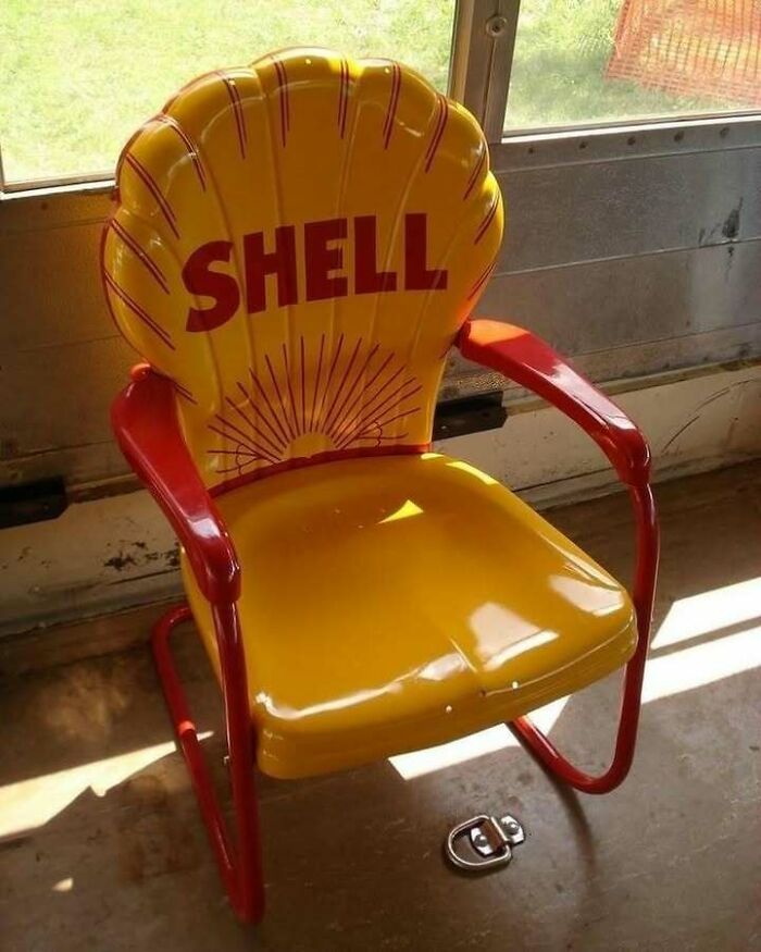 Recycled chair made from a Shell sign, showcasing creative recycling.