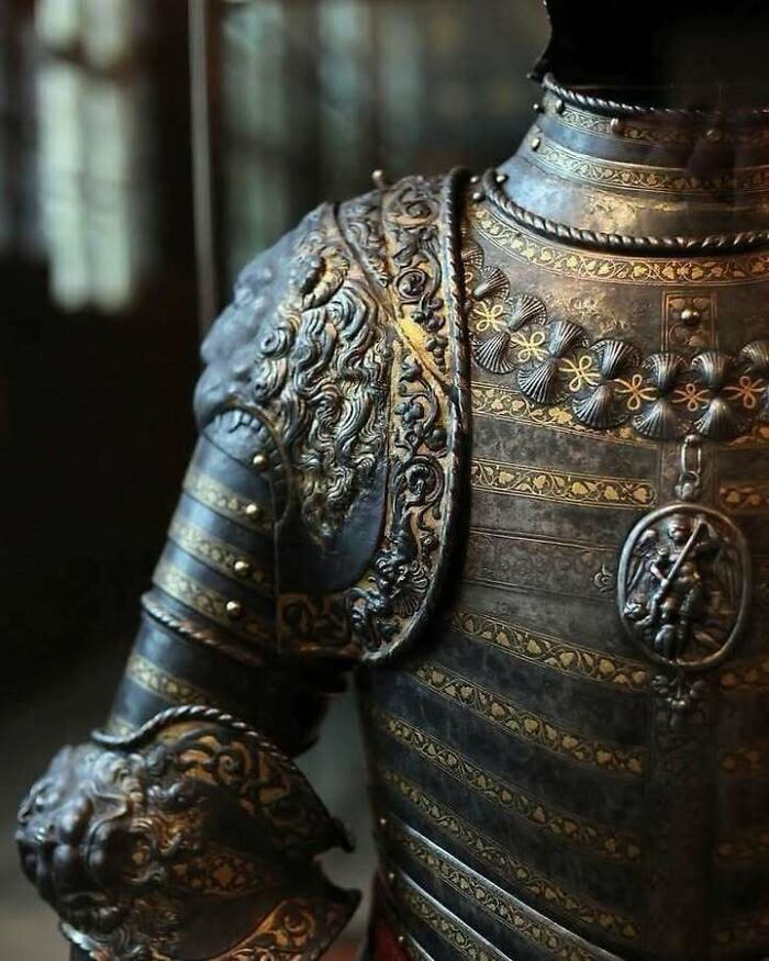 Ornate historical armor with intricate gold detailing, showcasing craftsmanship from a fascinating period in history.
