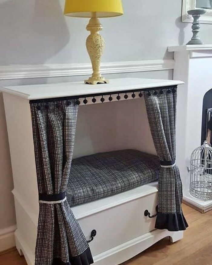 Upcycled furniture with a yellow lamp; a creative recycling idea with black and white checkered curtains.
