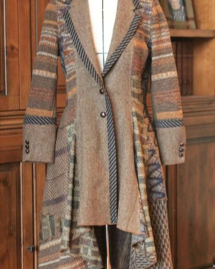 Recycled patchwork coat on a mannequin, showcasing sustainable fashion design.