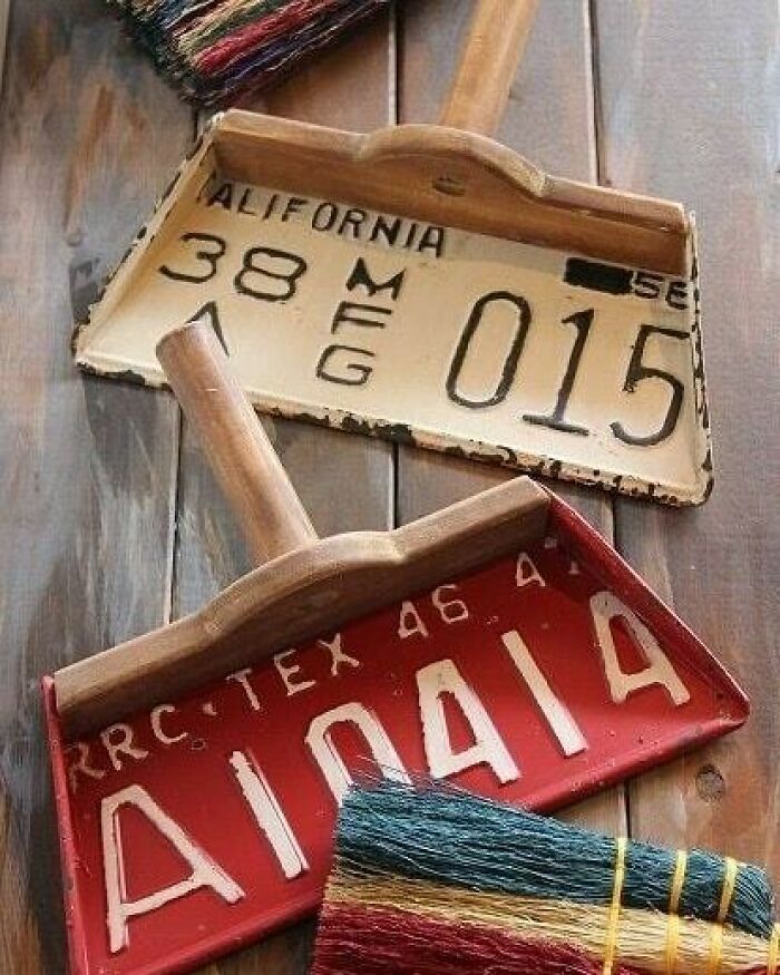 License plate dustpans with colorful brooms, showcasing creative recycling ideas.