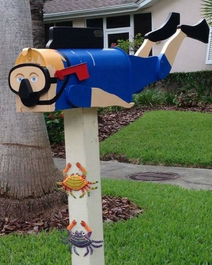 Creative mailbox transformed into a diver with crabs attached, inspiring recycling ideas.