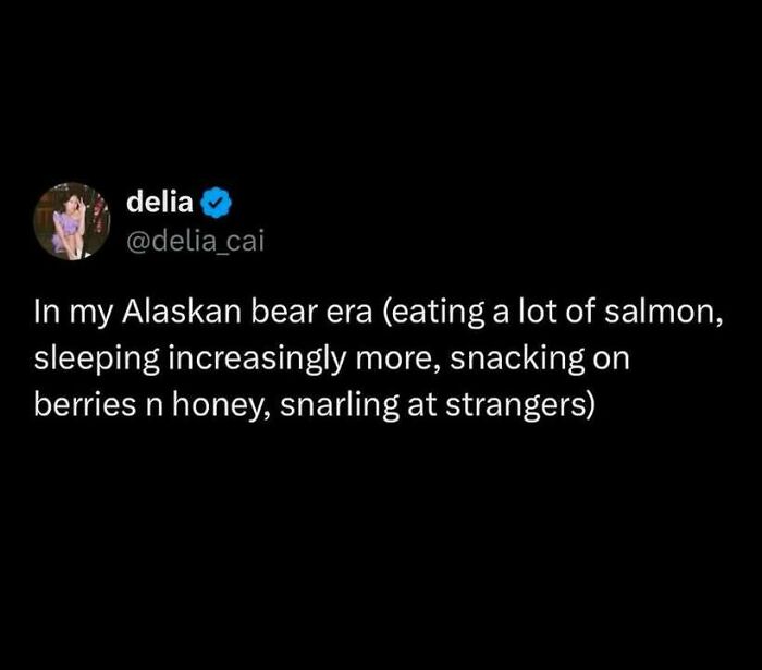 Tweet humorously describing an "Alaskan bear era" lifestyle. Social justice keywords.